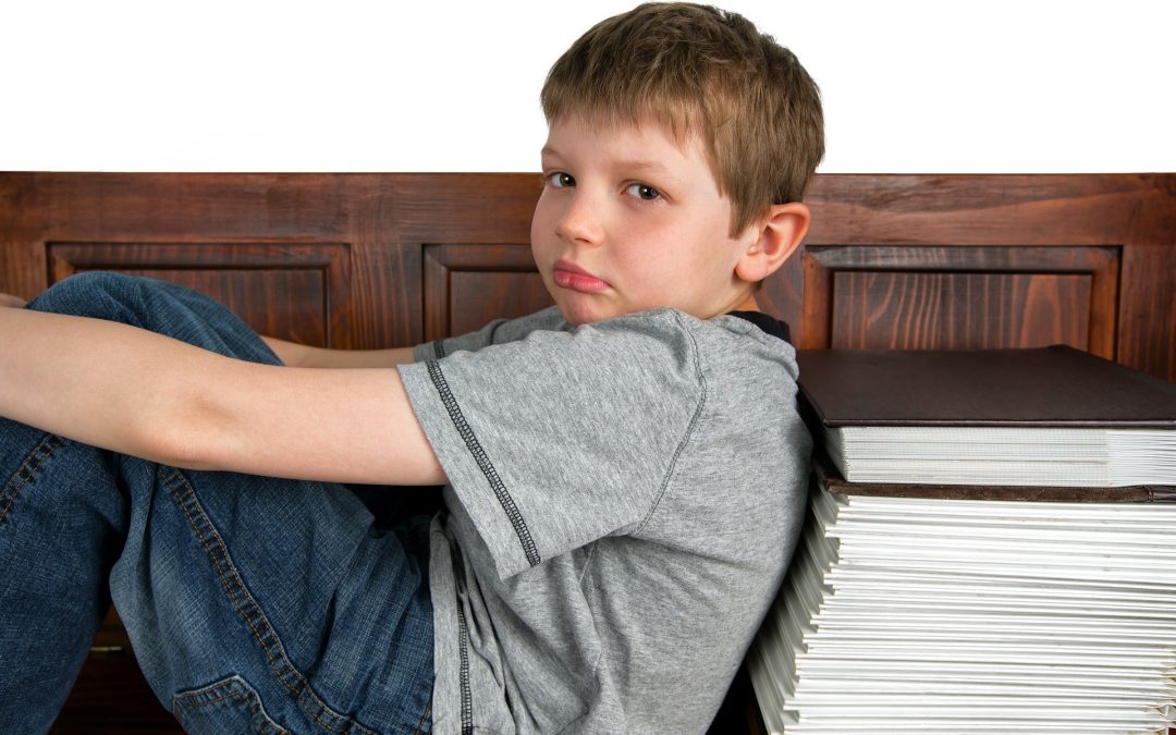 Child with autism seated on his own